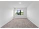 Bedroom features a window and carpet flooring at 38 W Harding St # C, Orlando, FL 32806