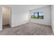Bedroom with gray carpeting and one window at 38 W Harding St # C, Orlando, FL 32806