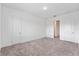 An empty bedroom with neutral walls and carpet flooring provides a blank canvas for customization at 38 W Harding St # C, Orlando, FL 32806