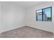 Bright bedroom with a large window offering natural light and views of the outdoors at 38 W Harding St # C, Orlando, FL 32806