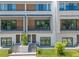 Close up of new construction townhomes featuring modern designs, front lawns and private entrances at 38 W Harding St # C, Orlando, FL 32806