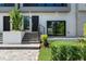 Inviting townhouse entrance featuring a modern design and manicured landscaping at 38 W Harding St # C, Orlando, FL 32806
