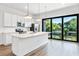 Modern kitchen with a large island, stainless steel appliances, and a sliding door to the outside at 38 W Harding St # C, Orlando, FL 32806