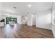Spacious living room with wood floors, recessed lighting, and staircase at 38 W Harding St # C, Orlando, FL 32806