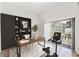 Contemporary office space with a large desk, shelving, and sliding doors for plenty of light at 38 W Harding St # C, Orlando, FL 32806