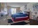 Bedroom featuring a double bed, window, and posters on the wall at 4161 Versailles Dr # 4161G, Orlando, FL 32808