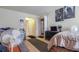 Bedroom with a bed, fan, storage, and posters on the walls at 4161 Versailles Dr # 4161G, Orlando, FL 32808