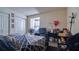 Bedroom with a double bed, closet, and shelves and posters on the wall at 4161 Versailles Dr # 4161G, Orlando, FL 32808