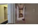 Hallway with tile floor and doors leading to other rooms at 4161 Versailles Dr # 4161G, Orlando, FL 32808