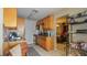 Functional kitchen featuring light wood cabinets and tile flooring, perfect for cooking at 4161 Versailles Dr # 4161G, Orlando, FL 32808