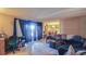 Bright and airy living room featuring tile floors and plenty of natural light at 4161 Versailles Dr # 4161G, Orlando, FL 32808