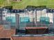 Birds-eye view of the screened in pools in the community, showing the pool layout and surrounding area at 4895 Clock Tower Dr, Kissimmee, FL 34746
