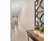 Welcoming hallway with neutral walls, tile flooring, and a decorative mirror at 4895 Clock Tower Dr, Kissimmee, FL 34746