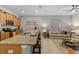Open-concept kitchen featuring a granite countertop island with seating and views of the living room at 4895 Clock Tower Dr, Kissimmee, FL 34746