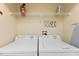 A laundry room with modern washer and dryer units for convenient home care at 4895 Clock Tower Dr, Kissimmee, FL 34746