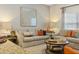 Comfortable living room with neutral tones and stylish furnishings, creating a cozy atmosphere at 4895 Clock Tower Dr, Kissimmee, FL 34746