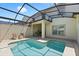 Screened-in pool featuring built-in steps and an adjacent covered patio area at 4895 Clock Tower Dr, Kissimmee, FL 34746