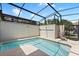 A refreshing swimming pool area enclosed in a screened-in lanai, providing privacy and comfort at 4895 Clock Tower Dr, Kissimmee, FL 34746