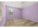 Bedroom featuring plush carpeting, neutral paint, ceiling fan and a window at 5252 Hidden Cypress Ln, Oviedo, FL 32765