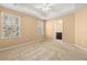 Bright bedroom with neutral tan walls that leads to a view of the bathroom at 5252 Hidden Cypress Ln, Oviedo, FL 32765