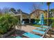 Community pool and lounge area with comfortable lounge seating, a covered pavilion, and mature palm trees at 5252 Hidden Cypress Ln, Oviedo, FL 32765