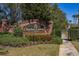 Clayton Crossing entrance sign with brick facade and manicured landscaping, creating an inviting welcome at 5252 Hidden Cypress Ln, Oviedo, FL 32765
