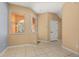 Beige entryway with tiled floor, a front door with side window, and a window with light coming through at 5252 Hidden Cypress Ln, Oviedo, FL 32765