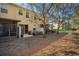 The backyard has a screen enclosure, a grassy area, and mature trees at 5252 Hidden Cypress Ln, Oviedo, FL 32765