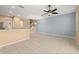 Bright living area with tile floors, ceiling fan, open floor plan and stairs to the upper level at 5252 Hidden Cypress Ln, Oviedo, FL 32765