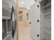 View of pantry located next to the stainless steel refrigerator at 5252 Hidden Cypress Ln, Oviedo, FL 32765