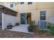 Cozy outdoor patio with sliding glass door access, garden planters, and air conditioning unit at 5252 Hidden Cypress Ln, Oviedo, FL 32765
