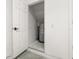 Handy storage room featuring water heater, concrete flooring, and an access door at 5252 Hidden Cypress Ln, Oviedo, FL 32765