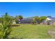 Large backyard featuring well-maintained lawn and mature landscaping at 5337 Foxshire Ct, Orlando, FL 32819