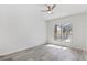 Bright bedroom with hardwood flooring and a view of the screened lanai at 5337 Foxshire Ct, Orlando, FL 32819