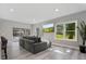 Inviting living room with a view of the screened-in pool area through large sliding glass doors at 5337 Foxshire Ct, Orlando, FL 32819