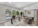 Stylish home office featuring large arched windows, ample natural light, and modern furnishings at 5337 Foxshire Ct, Orlando, FL 32819