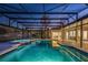 Screened pool features a jacuzzi, and overlooks a large green lawn with mature trees at 5337 Foxshire Ct, Orlando, FL 32819