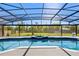 Beautiful screened-in pool with an outdoor hot tub and a view of the backyard at 5337 Foxshire Ct, Orlando, FL 32819