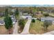 Aerial view of the house, long driveway, and surrounding neighborhood at 5410 S Pine Hill Cir, Orlando, FL 32808