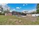 The backyard features a shed, patio, and mature trees at 5410 S Pine Hill Cir, Orlando, FL 32808