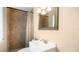 Cozy bathroom with tiled shower, neutral walls, and vanity at 5410 S Pine Hill Cir, Orlando, FL 32808