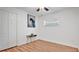 Bedroom with a closet, wood floors, and a window providing natural light at 5410 S Pine Hill Cir, Orlando, FL 32808