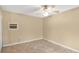 Inviting bedroom featuring neutral walls, tile floors, and a ceiling fan at 5410 S Pine Hill Cir, Orlando, FL 32808