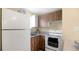 Well-lit kitchen with modern appliances, wooden cabinets, and a functional layout at 5410 S Pine Hill Cir, Orlando, FL 32808