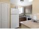 Charming kitchen featuring ample counter space, wooden cabinets, and modern appliances at 5410 S Pine Hill Cir, Orlando, FL 32808