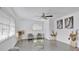 Bright living room with tile floors, neutral paint, and lots of natural light from two windows at 5410 S Pine Hill Cir, Orlando, FL 32808