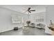 Bright living room with tile floors, neutral paint, and lots of natural light from two windows at 5410 S Pine Hill Cir, Orlando, FL 32808