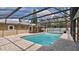 Expansive screened-in pool area with outdoor space and beautiful surroundings at 5410 S Pine Hill Cir, Orlando, FL 32808