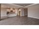 Open-concept living room and kitchen featuring hardwood floors, recessed lighting, and stainless steel appliances at 5640 Nevis Ter, Kissimmee, FL 34758
