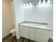 Bathroom features a double sink vanity with stone countertops and modern fixtures and finishes at 7 Locust Run, Ocala, FL 34472